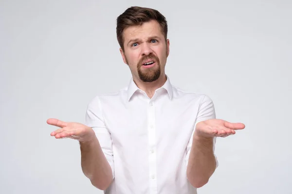 Confused caucasian man is unsure having no idea what to do next — Stock Photo, Image