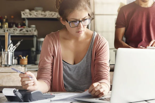 woman looking at laptop screen