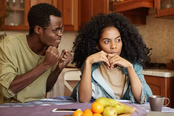 Husband clenching fists mad at indifferent wife — Stock Photo