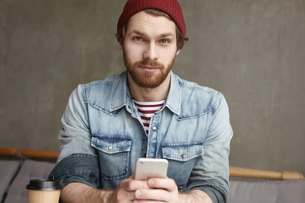 male holding mobile phone