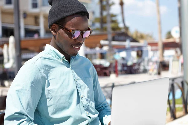 black male using notebook