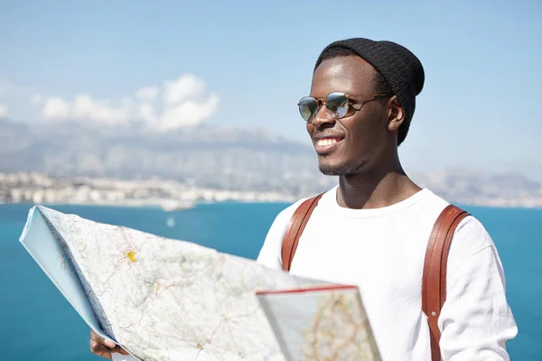 Afro American male tourist enjoying landscape