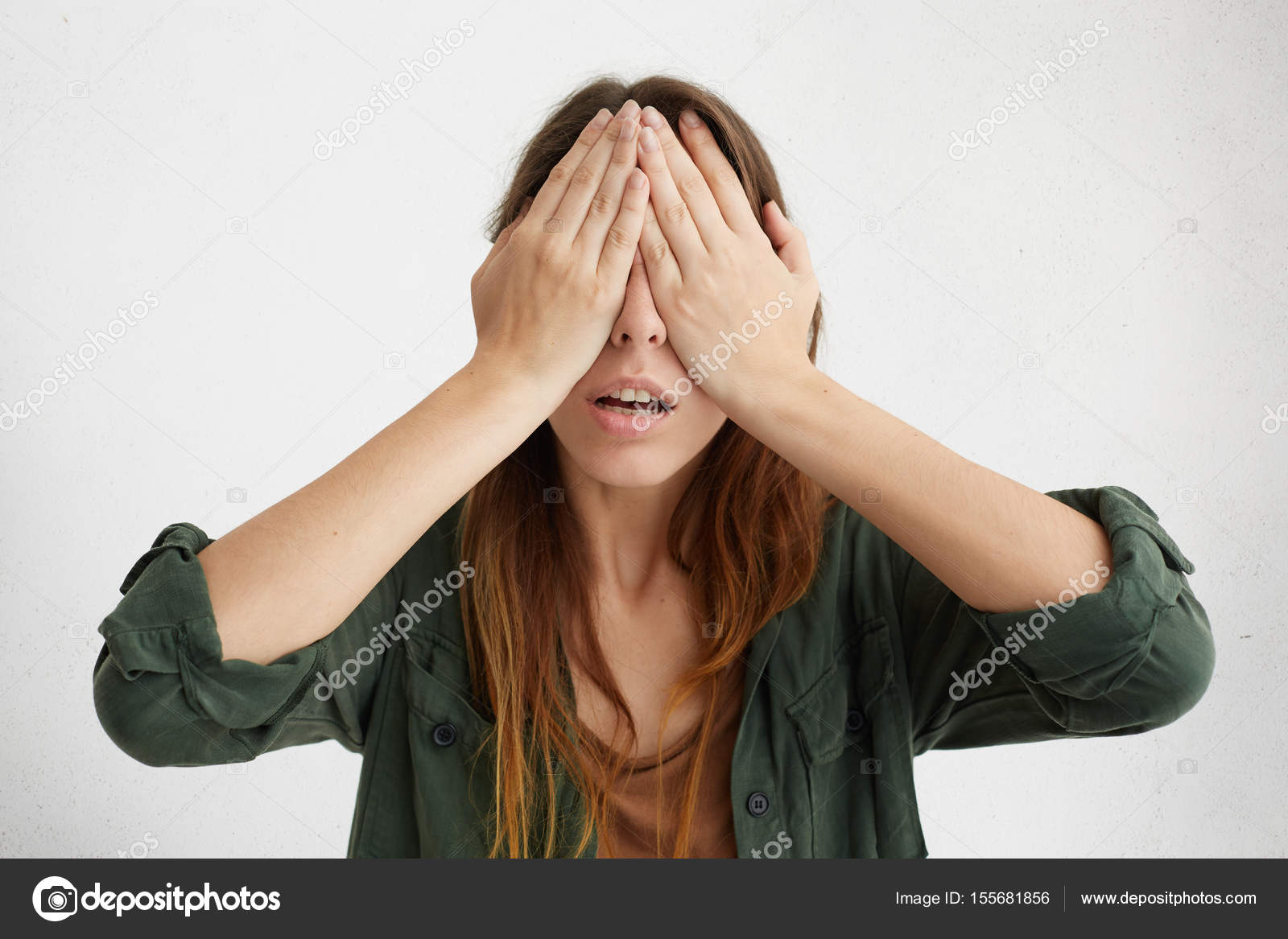 woman covering her eyes with hands — Stock Photo © avemario 155681856