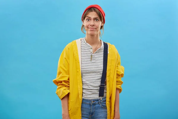 dissatisfied woman wearing red hat