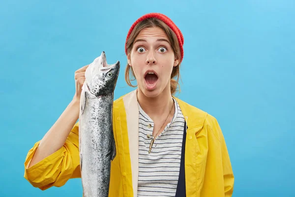 fisher woman holding big fish