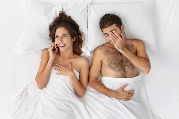 Couple stays up late being tired
