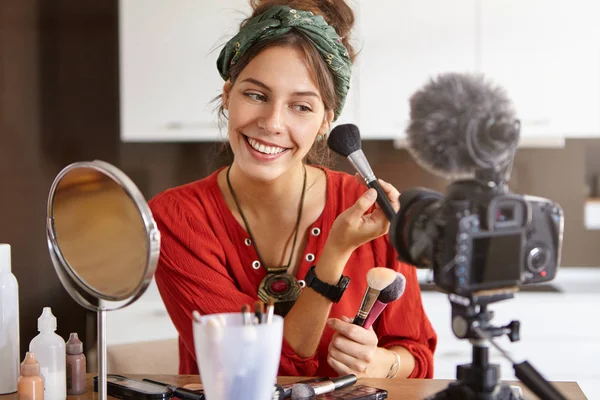 woman make up artist recording video tutorial