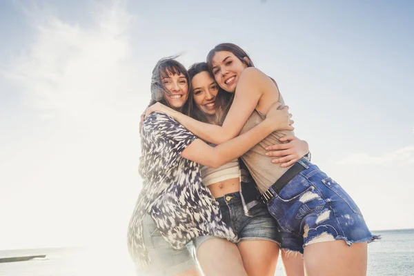 Group Three Young Woman Enjoy Summer Rock Beach Tenerife Hug — Stock Photo, Image