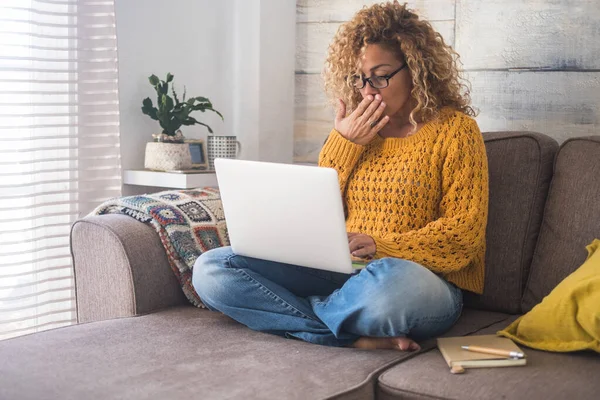 Surprised Adult Woman Home Sitting Sofa Personal Laptop Computer — Stockfoto