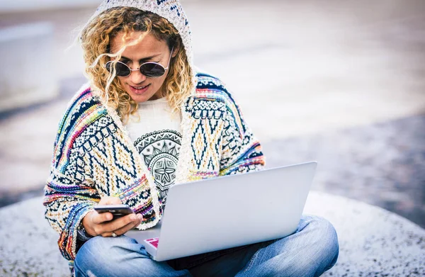 Woman at work with roaming internet technology outdoor during travel lifestyle