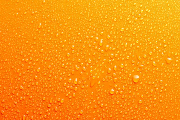 Su damlaları turuncu arka plan doku