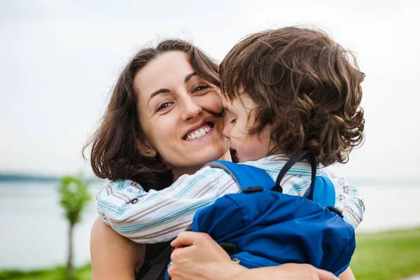 A woman is hugging a boy. — Stock Photo, Image