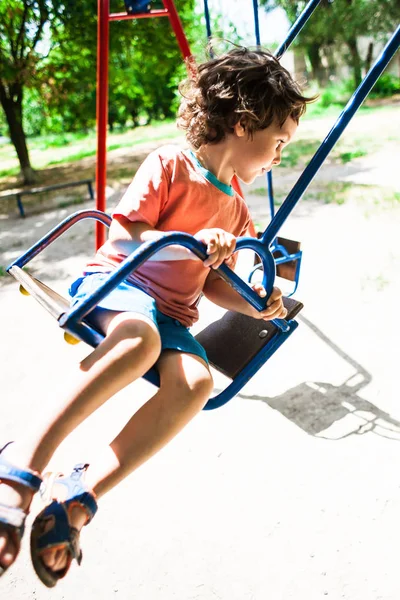 Child is having fun on the swing. — Stock Photo, Image