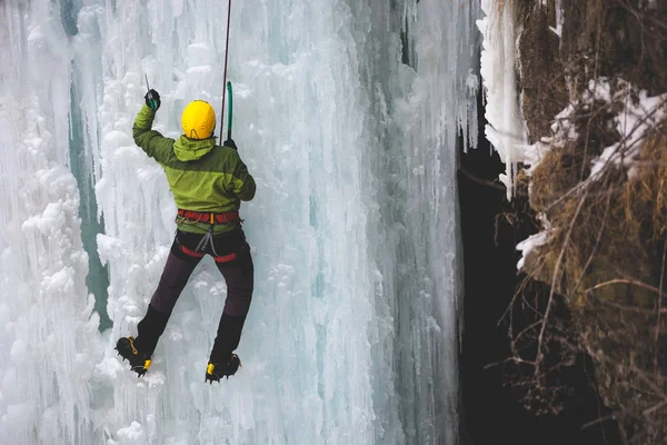 The climber climbs on ice. Stock Image