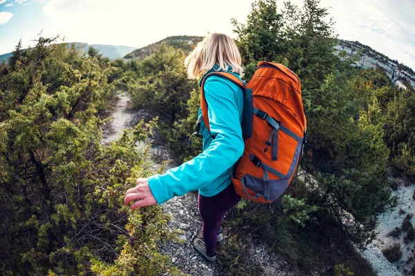 A girl with a backpack.