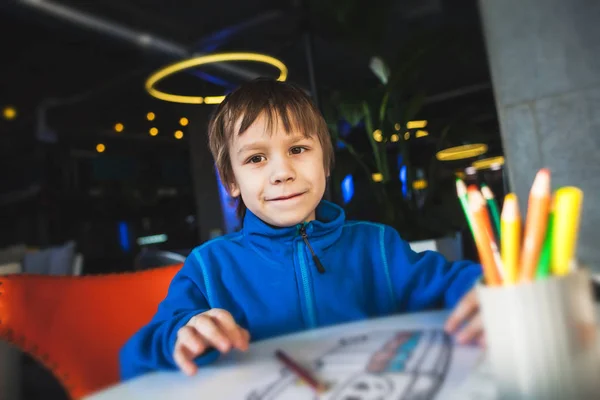 The boy draws with pencils. — Stock Photo, Image