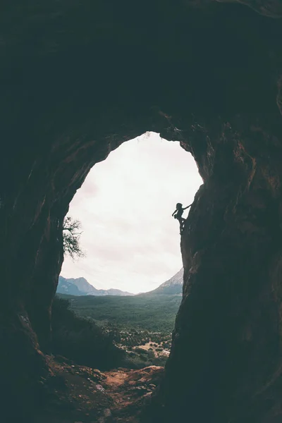 Silhouette of a rock climber on a background of Turkish mountains.