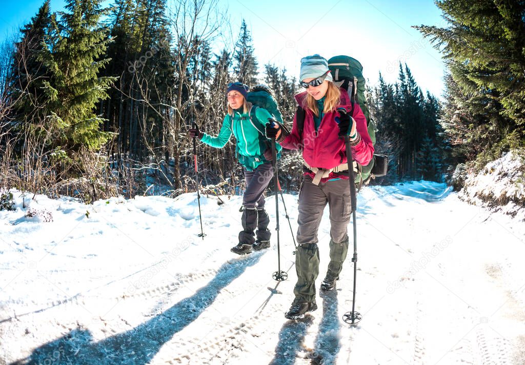 Two women in a winter hike.
