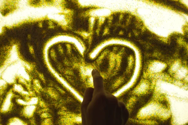 Sand animation on a special table.