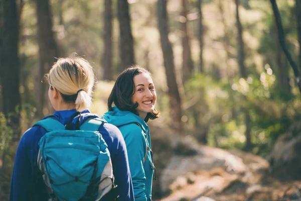 Two Girls Backpacks Walk Woods Hiking Mountains Girlfriends Spend Time — Stock Photo, Image