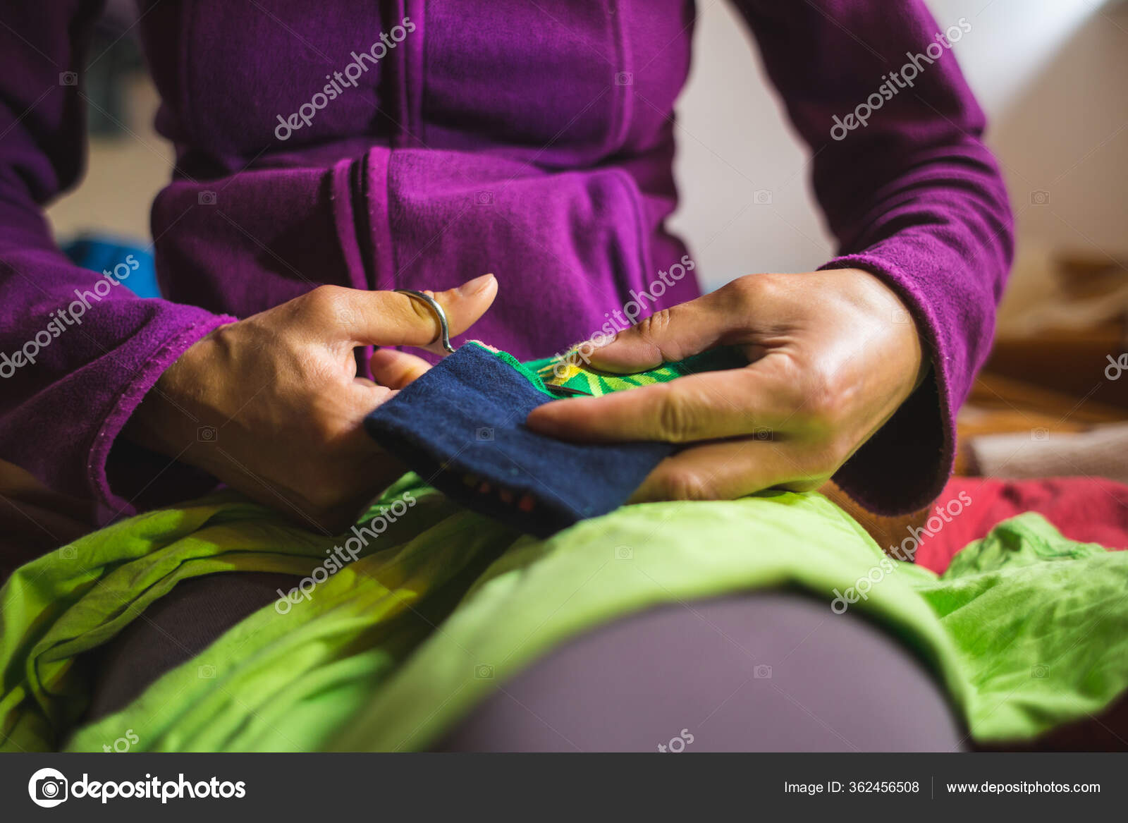 Woman Sews Patch Torn Clothes Old Sock Restoration Clothing Improvised