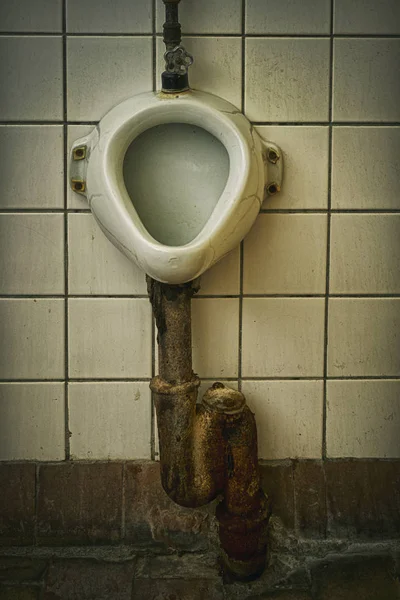 Dirty old soviet urinal in public toilet — Stock Photo, Image