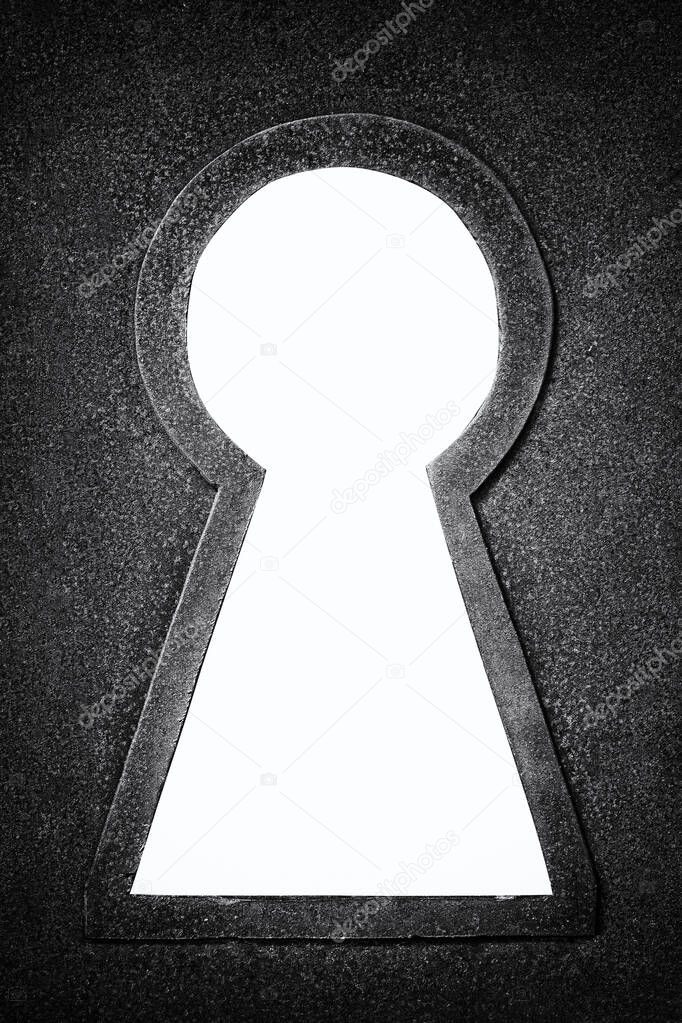 Metallic keyhole isolated on white black and white photo