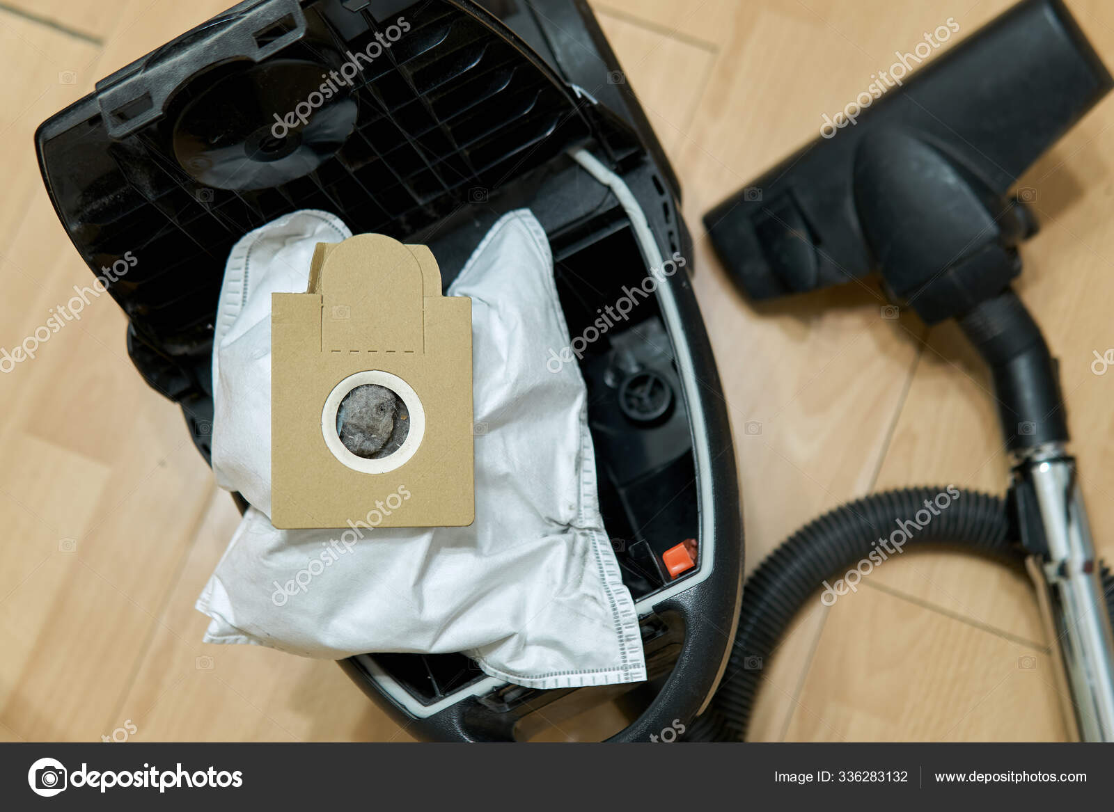 Dust bag full of garbage in the opened vacuum cleaner Stock Photo by  ©astrophytum 336283132