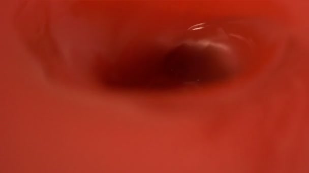 Red water or blood spiraling down a sink — Stok video