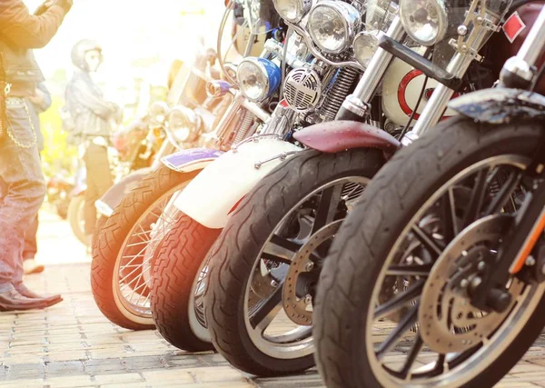 Row of vintage motorbikes on sunset