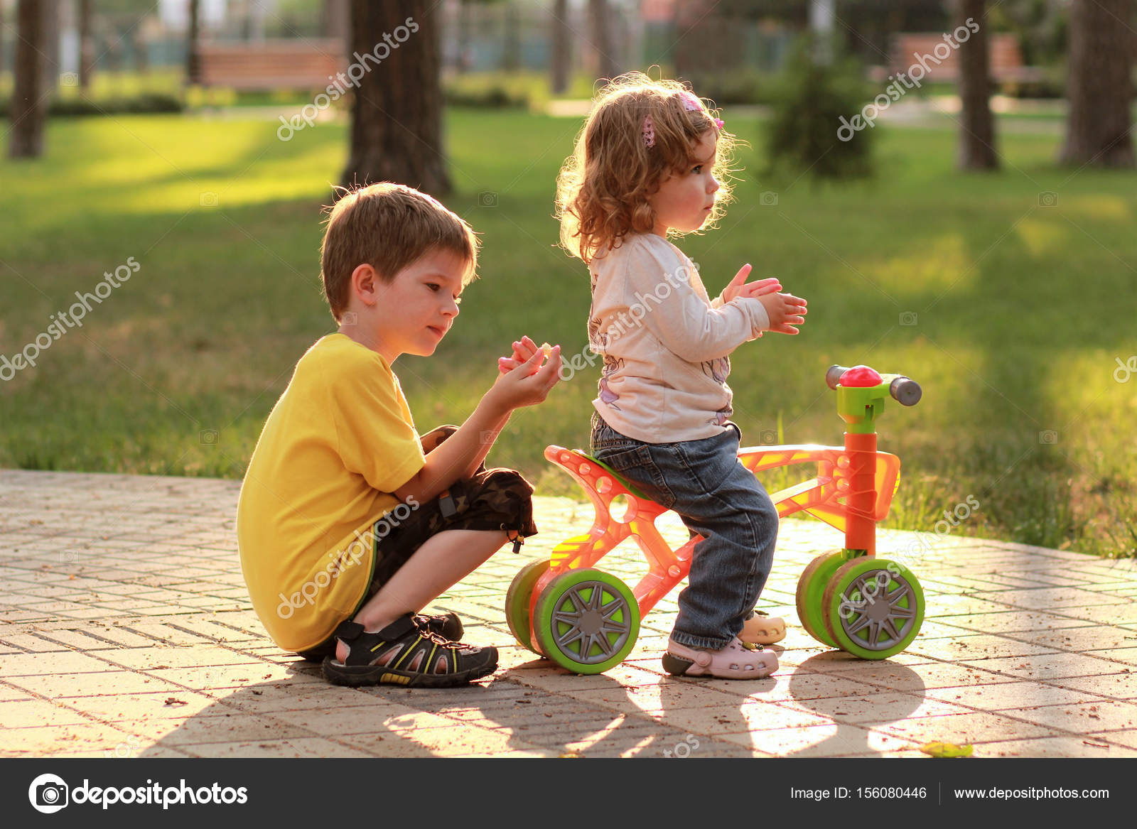 girl riding bike with boy