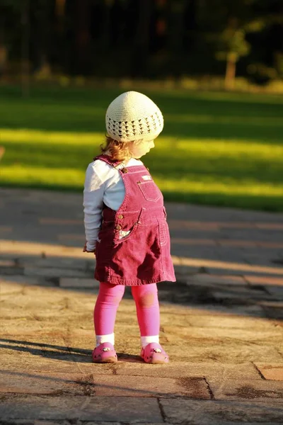 Portrait of a funny one year old girl protruding her belly — Stock Photo, Image