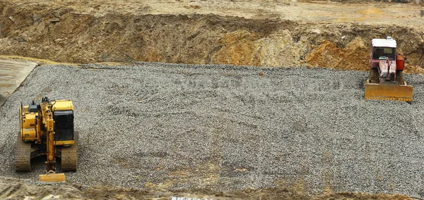 Buldozer ve inşaat sitesinde çalışan Ekskavatör