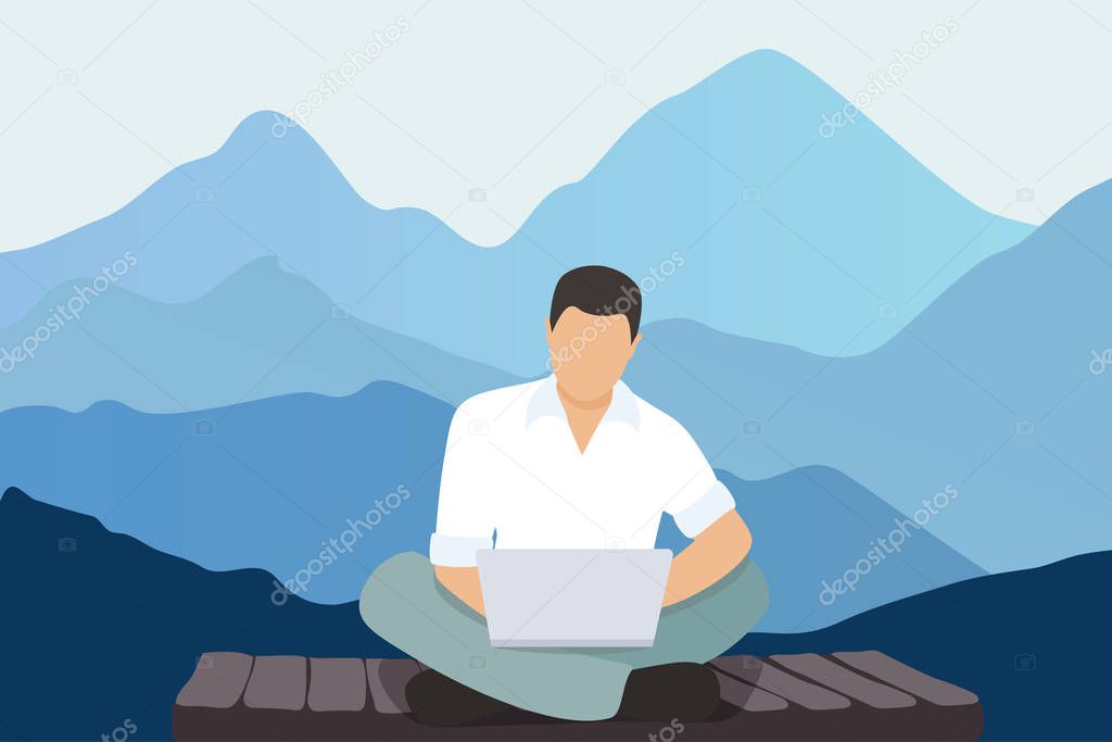 Young man with a laptop working in the mountains. Freelance concept
