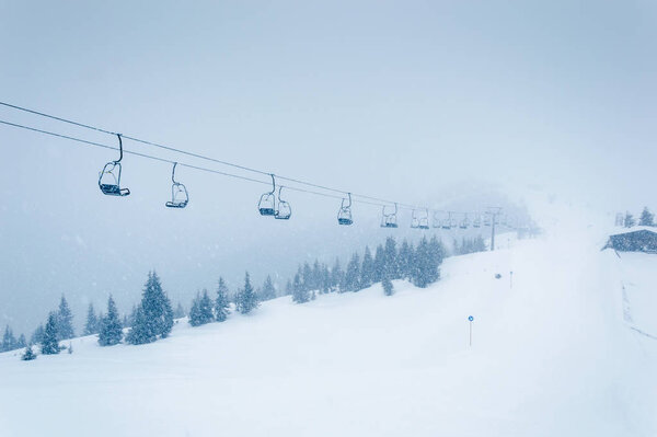 Mountains ski resort Zell am See Kaprun, Austria with snowy forest, cable car and snow in Austrian Alps