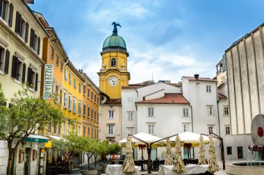 Square behind yellow City Clock Tower in Rijeka, Croatia