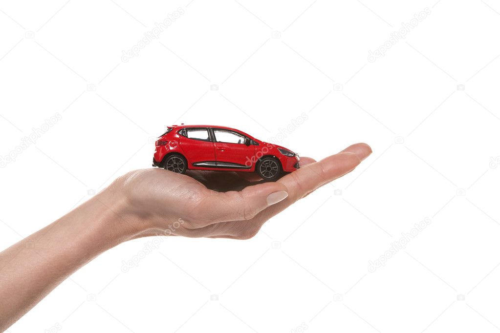Hand holding a little car