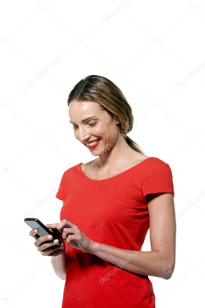 Happy woman text messaging on smart phone