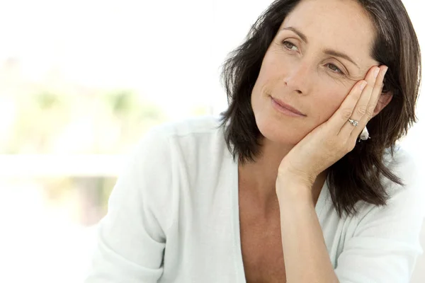 Thoughtful middle aged woman — Stock Photo, Image