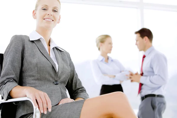 Happy executive businesswoman at workplace — Stock Photo, Image