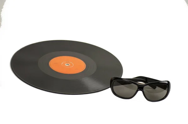 Vintage vinyl record i okulary — Zdjęcie stockowe