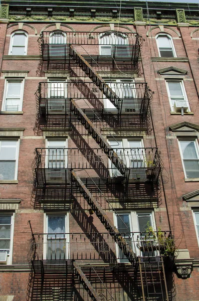 The typical old houses with fire stairs in Manhattan New York