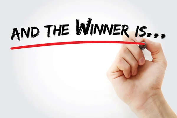 Hand writing And the winner is with marker — Stock Photo, Image