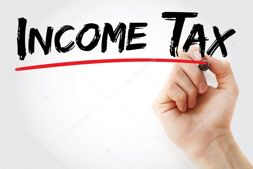 Hand writing Income Tax with marker