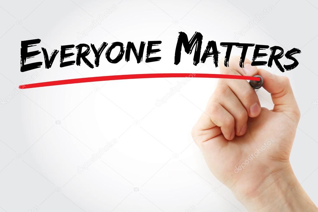 Hand writing Everyone Matters with marker