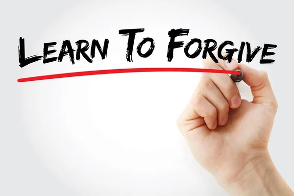 Написание от руки Научитесь прощать с маркером — стоковое фото