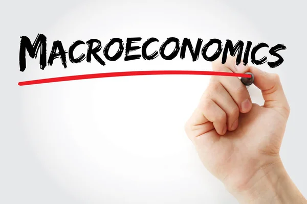 Hand writing Macroeconomics with marker — Stock Photo, Image