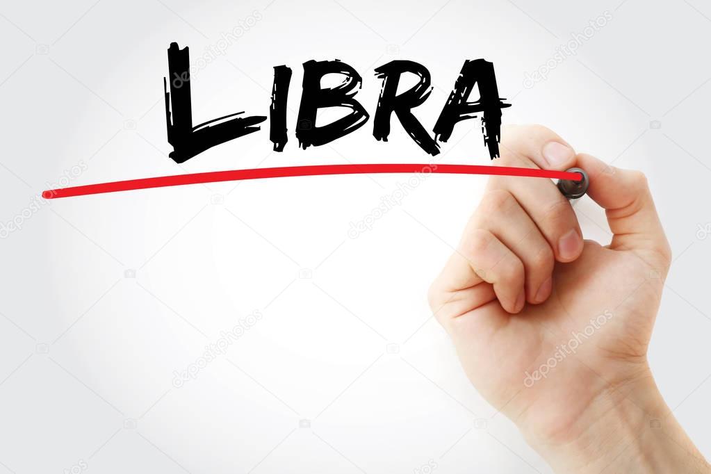 Hand writing Libra with marker