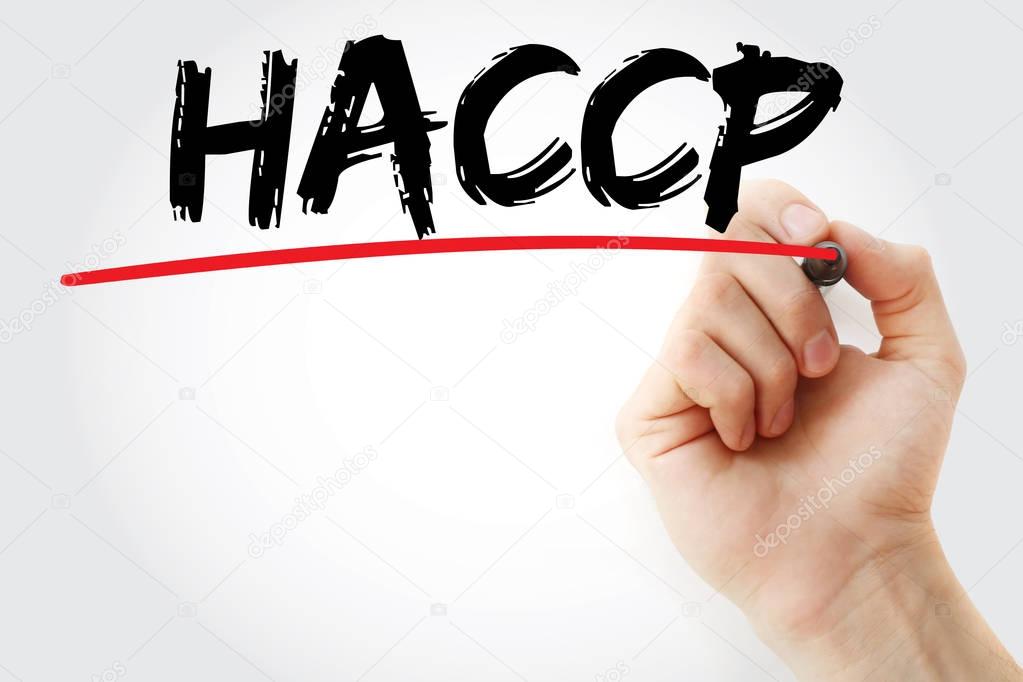 Hand writing HACCP with marker