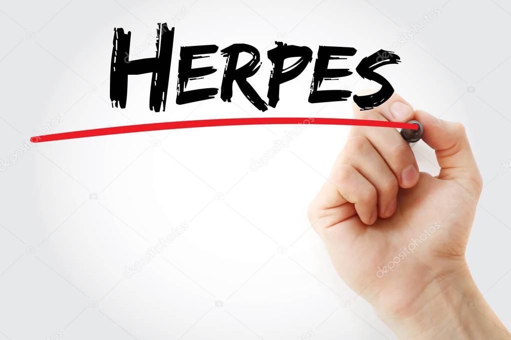 Hand writing Herpes with marker